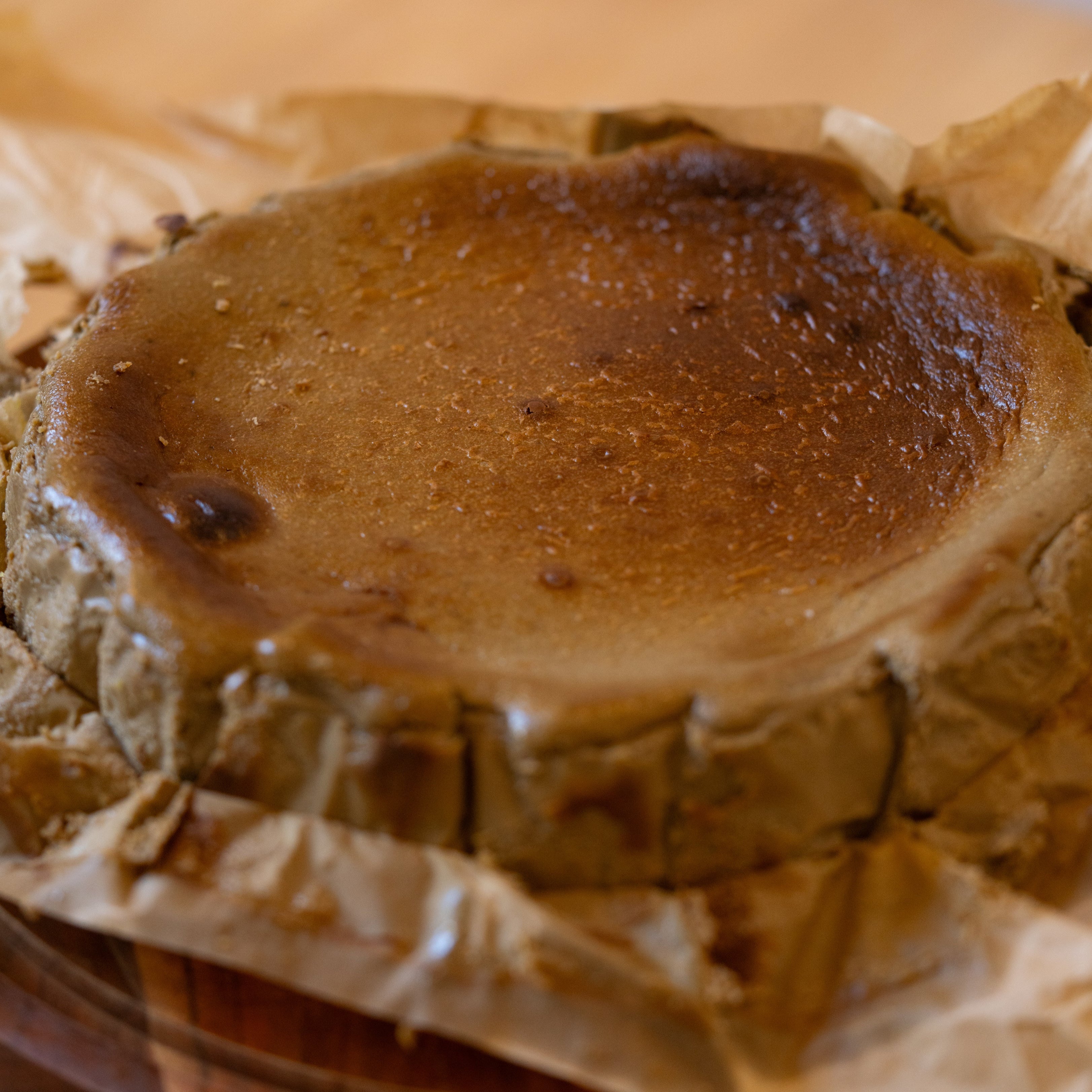 Baked dessert on a wooden board with brown paper